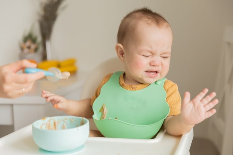 A,Child,Of,1,Year,Is,Naughty,At,The,Table,